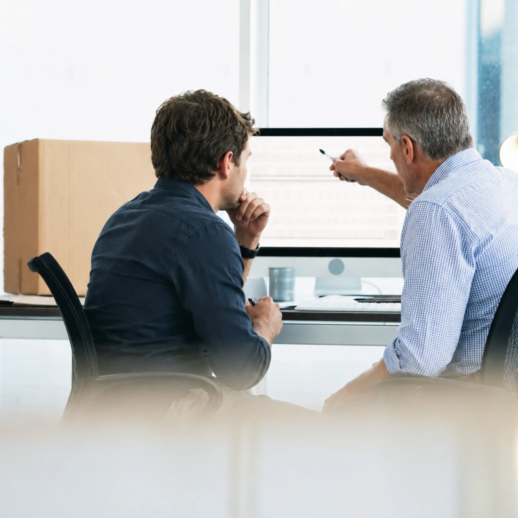 Business Colleagues Reviewing Data on Screen Business Colleagues Reviewing Data on Screen