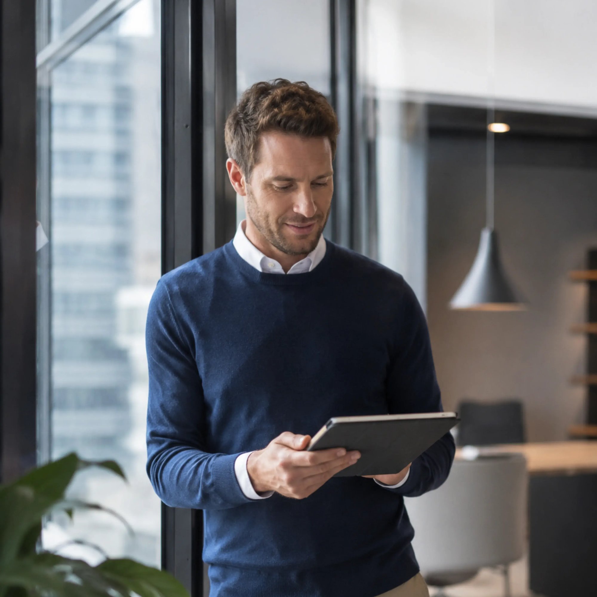Business Professional Using Tablet in Office