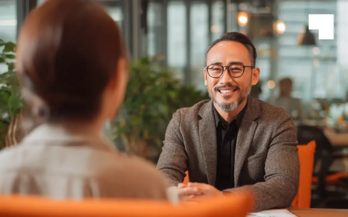 Professional business meeting between authorised representative and client discussing BVI regulatory services