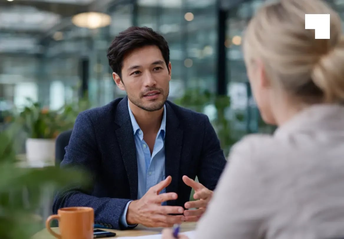 Professional business meeting discussing corporate governance and fiduciary services in modern office setting