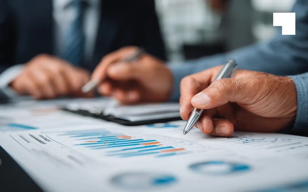Business professionals reviewing fund governance charts and financial compliance data at meeting