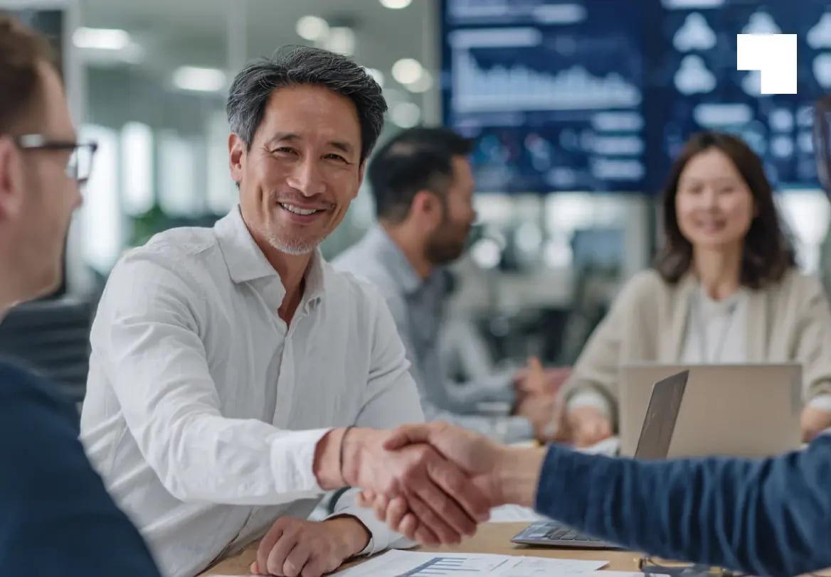 Business professionals shaking hands in modern office during process agent consultation meeting