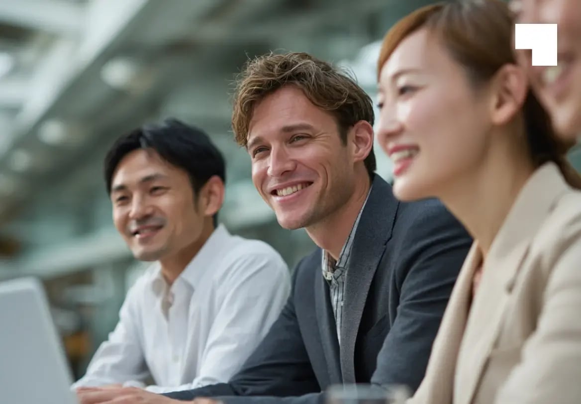Diverse team of trust administration professionals smiling during client consultation meeting