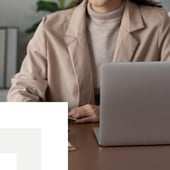Businesswoman with a laptop on desk