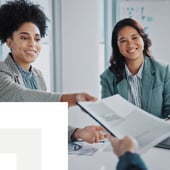 Businesswomen sharing documents