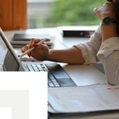 Businesswoman working on a laptop at home