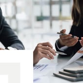 two people reviewing documents