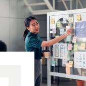 Businesswomen showcasing sticky notes