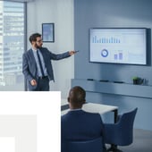 Businessman showing graphs to colleague 