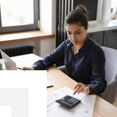 Businesswoman on calculator