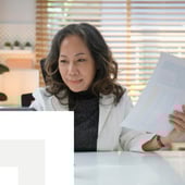 Businesswoman reviewing documents