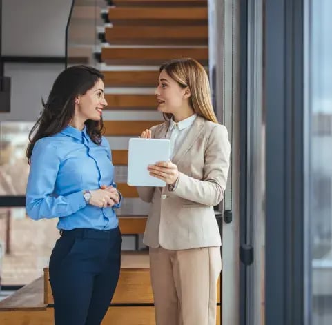 Businesswomen discussing a document