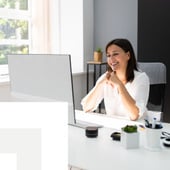 Businesswoman watching laptop
